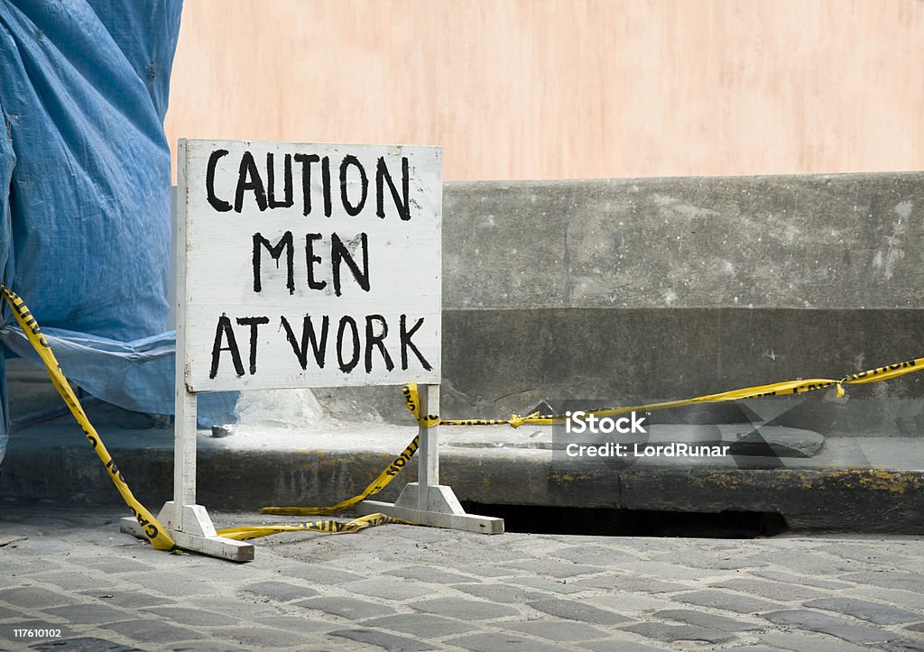 Men at work  Barricade Tape Stock Photo