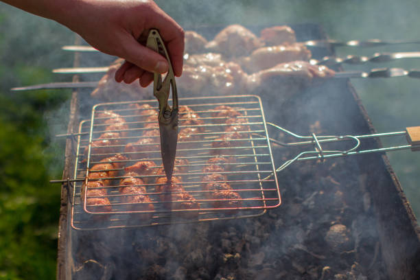 istock Check sausages and a kebab knife. Barbecue is done. Check skewers for roasting. 1176101969