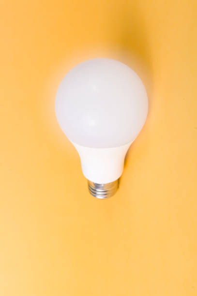 istock Energy saving home led light bulb with yellow background 1176102444