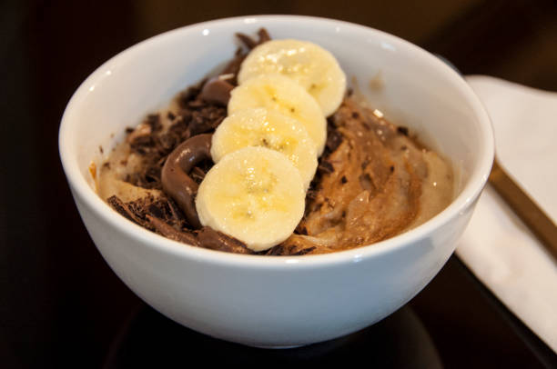 istock Fresh tasty smoothie bowl with fruit seeds and nuts. 1176103556