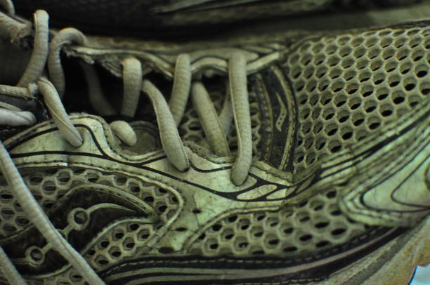 Mens silver, white and blue trainer texture close up.