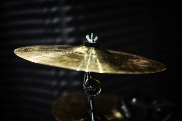 istock Gold plates from the drum set in the recording Studio. Professional drummers play recording 1176105402