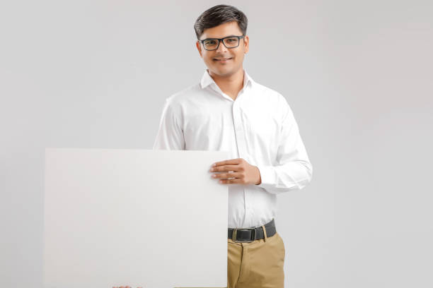 istock Indian/Asian Young Man showing blank signboard on White background 1176106696