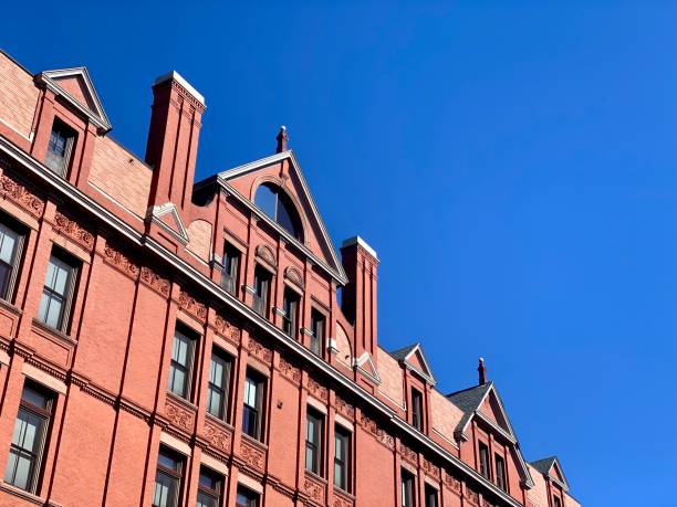 istock Copy space in blue sky over an old brick building facade 1176106727