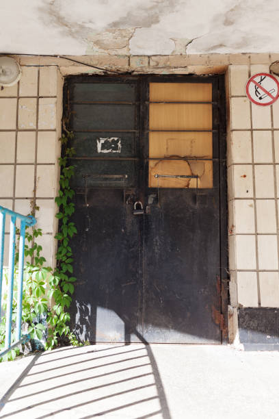 istock Old vintage wall with worn metal door 1176106774