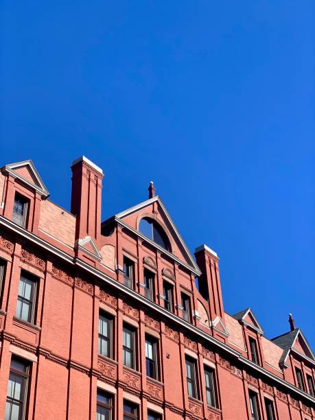istock Copy space in blue sky over an old brick building facade 1176106775