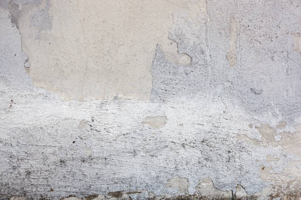 istock Texture of a concrete wall with cracks and scratches which can be used as a background 1176106908
