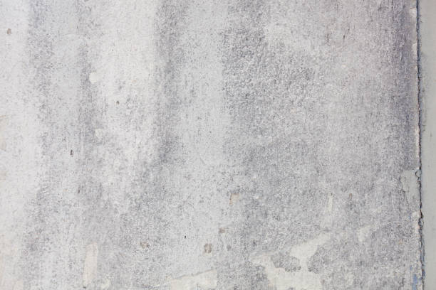 istock Texture of a concrete wall with cracks and scratches which can be used as a background 1176107205