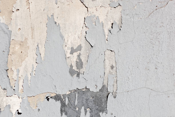 istock Texture of a concrete wall with cracks and scratches which can be used as a background 1176107311