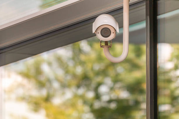 istock CCTV or surveillance camera operating on window building with green trees foliage reflection of shopping mall 1176107357
