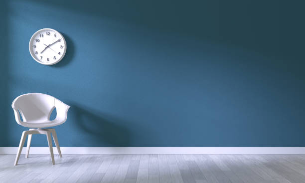 istock white chair on room dark blue wall background.3D rendering 1176114903