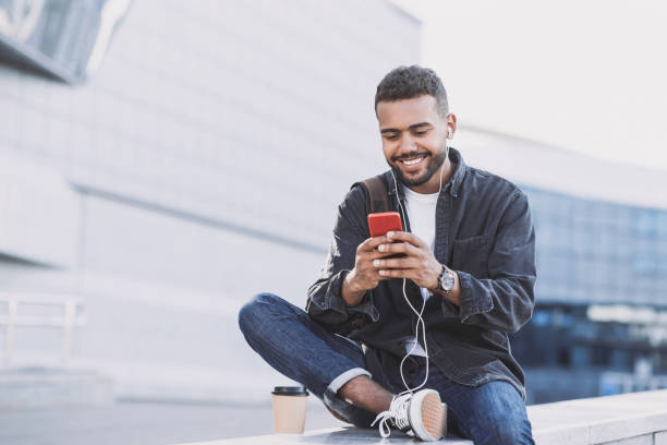 istock Handsome young man using smart phone in a city 1176117739