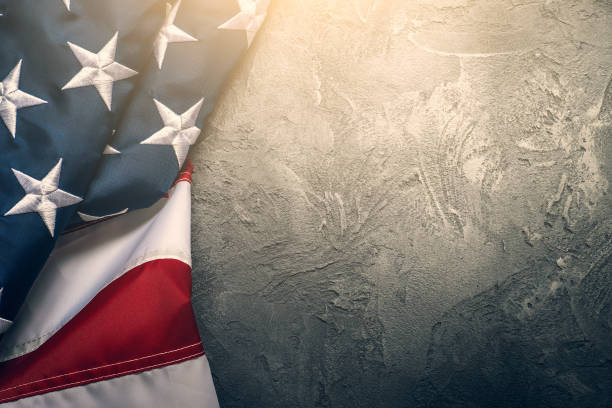 istock American or USA flag on concrete background with copy space for text, top view 1176117989