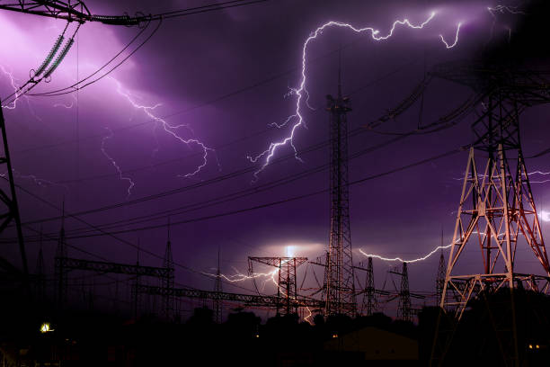 high voltage electrical substation illuminated by lightning flashes during an impending storm at night high voltage electrical substation illuminated by lightning flashes during an impending storm at night lightning tower stock pictures, royalty-free photos & images