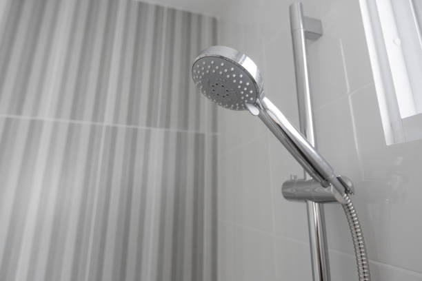 istock Shower head close up in the shower stall. 1176125289