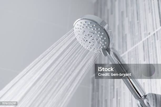 Water Running From Shower Head And Faucet In Modern Bathroom Stock Photo - Download Image Now