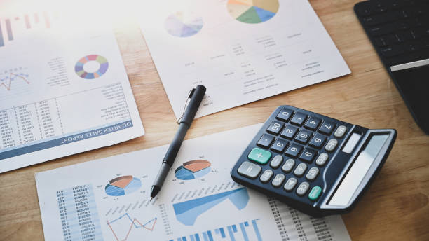 istock Financial table with calculator finance data with pen. 1176125503