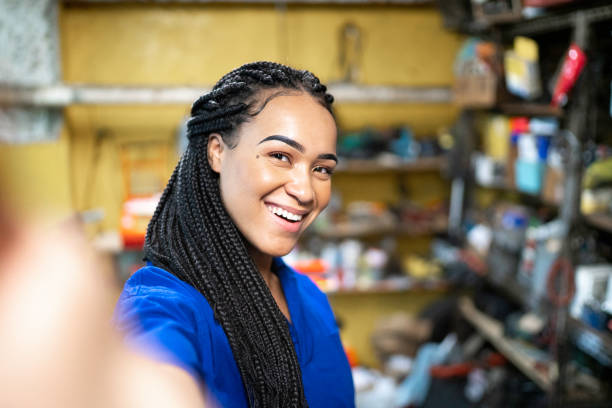 istock Mechanic taking a selfie in auto repair shop 1176126559