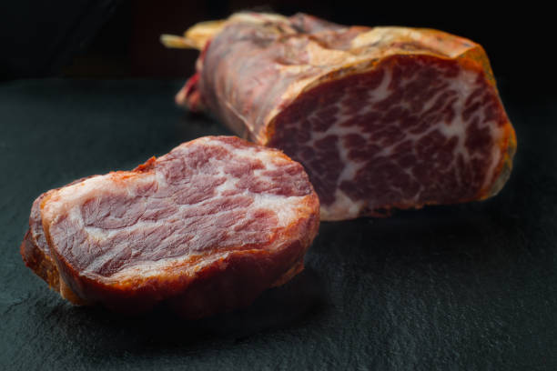 istock delicious Iberian pork loin on black background 1176126779