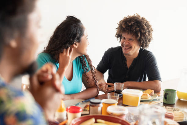 istock Couple sitting at table with food 1176126790