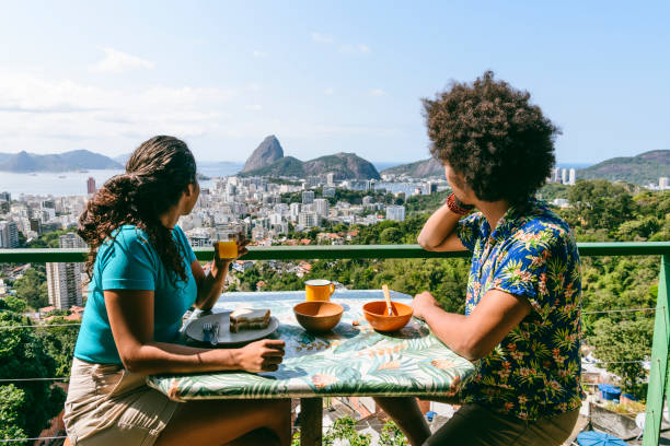 Sugarloaf Mountain breakfast view, Rio de Janeiro, Couple on holiday in Rio de Janeiro, sitting at table, enjoying breakfast al fresco casa stock pictures, royalty-free photos & images