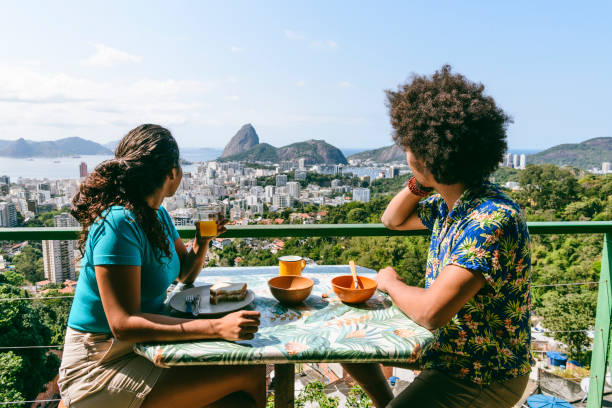 Sugarloaf Mountain breakfast view, Rio de Janeiro, Couple on holiday in Rio de Janeiro, sitting at table, enjoying breakfast al fresco travel hotel accommodations stock pictures, royalty-free photos & images
