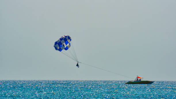 istock Parasailing, towing behind a man’s boat in a parachute system 1176130098