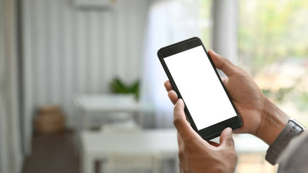 istock Mockup smartphone on man hands with isolated screen in cafe. 1176132427