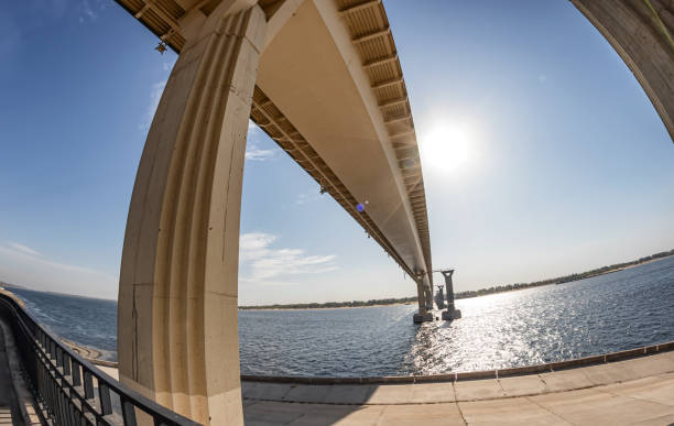 istock Bottom view of  bridge under construction across the river 1176133229