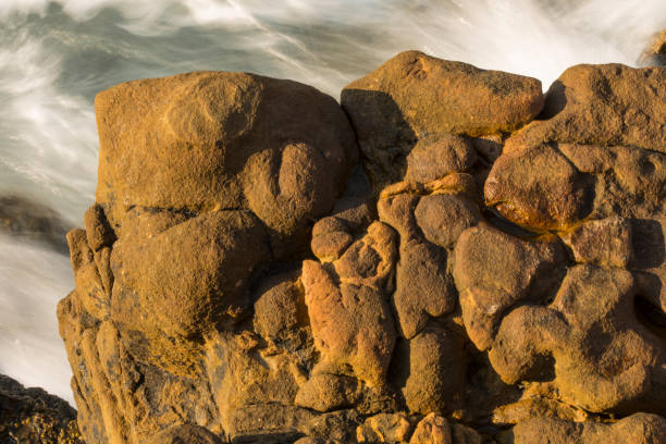 Views of young geological rocks and spectacular waves. Nature, geology, rocks concept. Horizontal close-up detail. Yıldızkoy, Gokceada, Turkey.