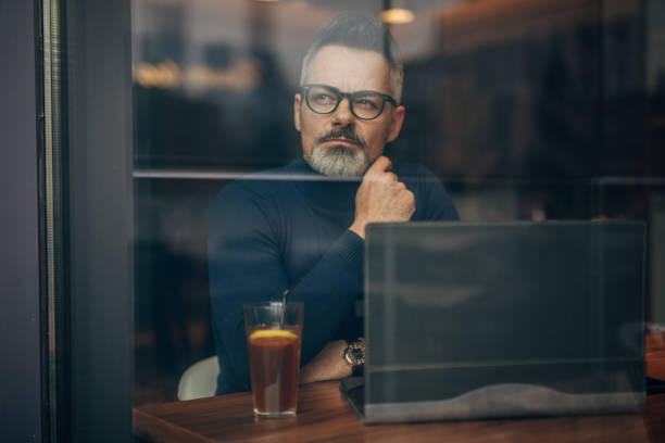 istock Gentleman sitting in cafe 1176135691