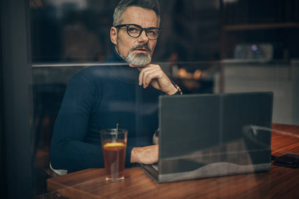 istock Modern gentleman sitting in cafe 1176135710