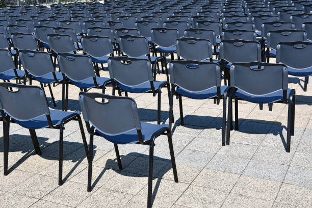 istock Plastic chairs in a row outdoors 1176136929