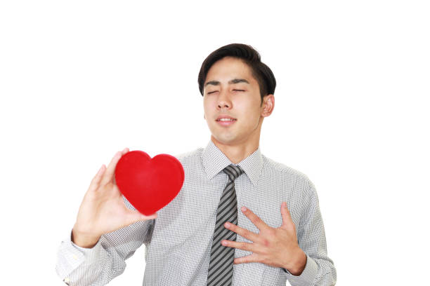 Smiling man with a red heart