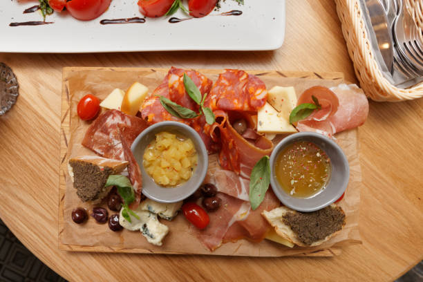 istock Meat, cheese and another starters on wooden board 1176139907