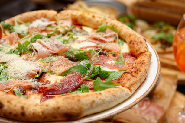 istock Pizza with prosciutto ham and parmesan 1176139959