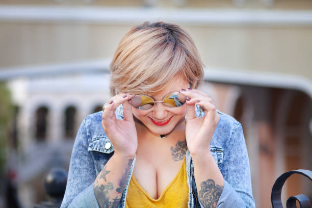istock Smiling cheerful blond thai girl with sunglasses 1176143483