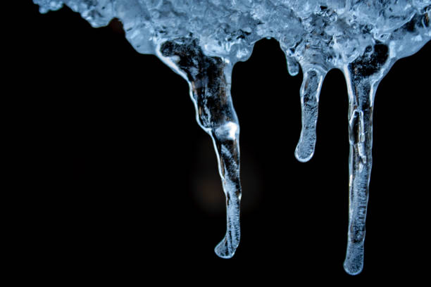 beautiful shiny transparent icicles hang on a clear day