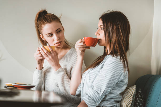 istock Young Female Friends is Having a Coffee Break 1176146133