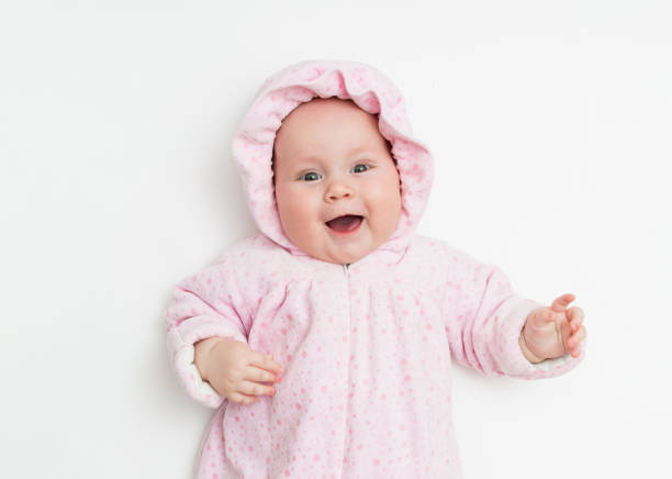 istock Cute baby dressed in warm overall for winter cold weather. 1176147399