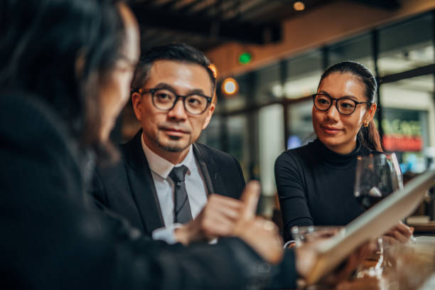 istock Business people sitting in restaurant 1176147550