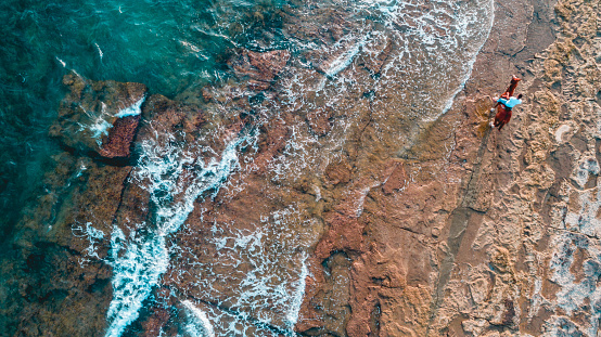 Horse rider on the beach aerial view