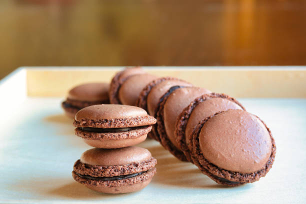 istock homemade chocolate macarons on a wooden tray 1176148372