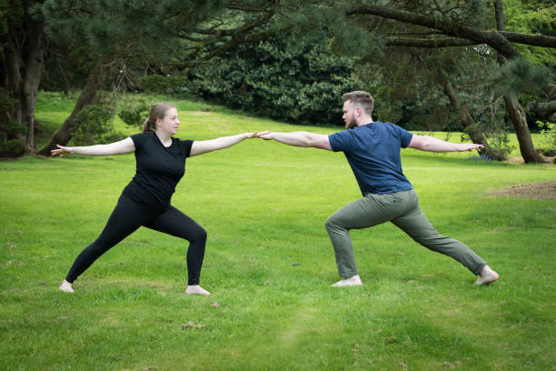 istock Young couple exercising in the park 1176148818