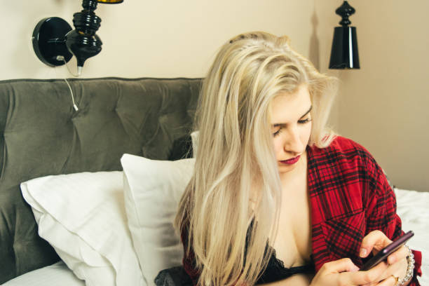 istock Beautiful woman using her phone stock photo 1176149886