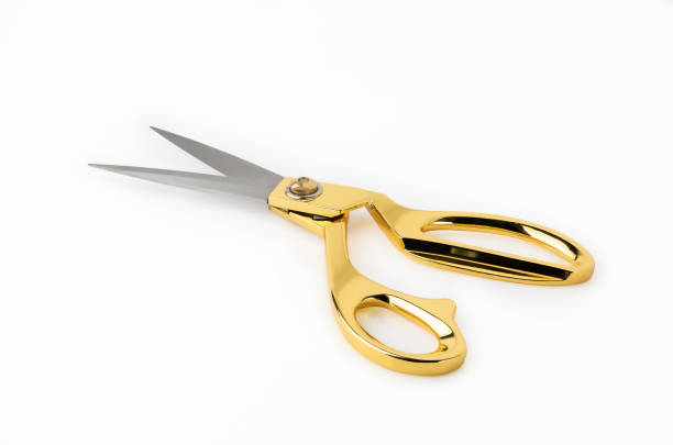 istock Golden scissors isolated on white background. Clipping path for artwork and design. 1176151007