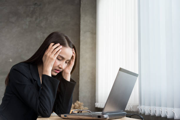 istock Image of young office woman  headache  while sit working desk,concept office syndrome. 1176151211