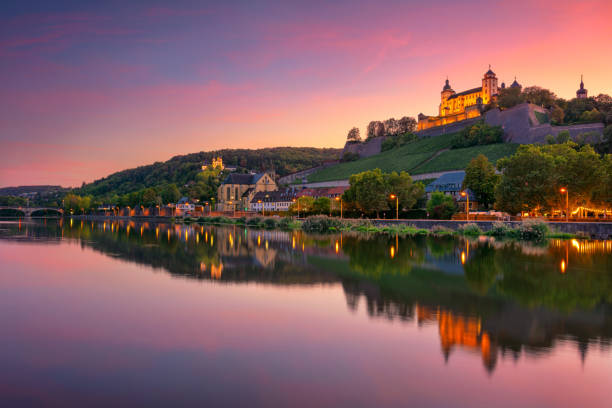 Wurzburg, Germany. Cityscape image of Wurzburg with Marienberg Fortress and reflection of the city in Main Rive during beautiful sunset. franconia stock pictures, royalty-free photos & images