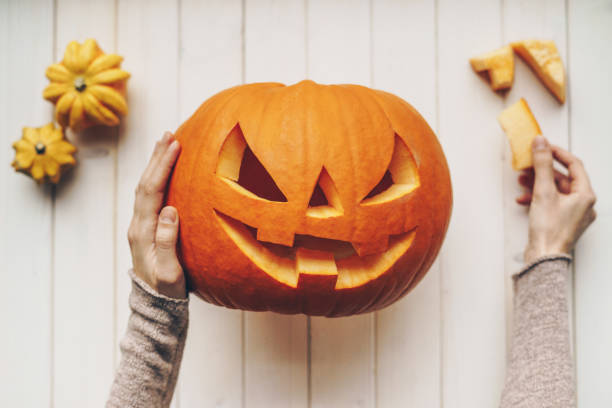 Woman holding a Halloween pumpkin