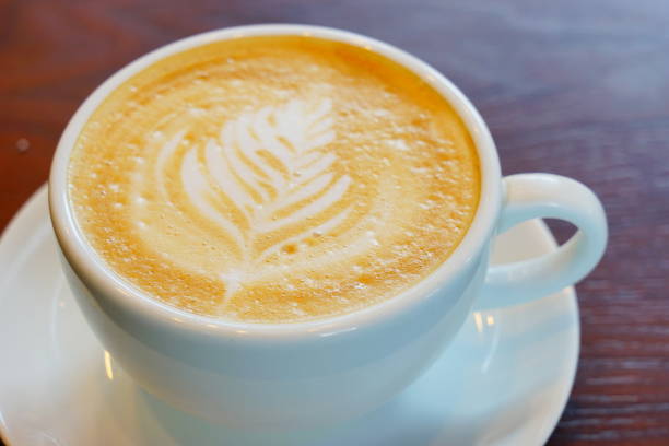 istock A cup of latte on wooden table 1176151500